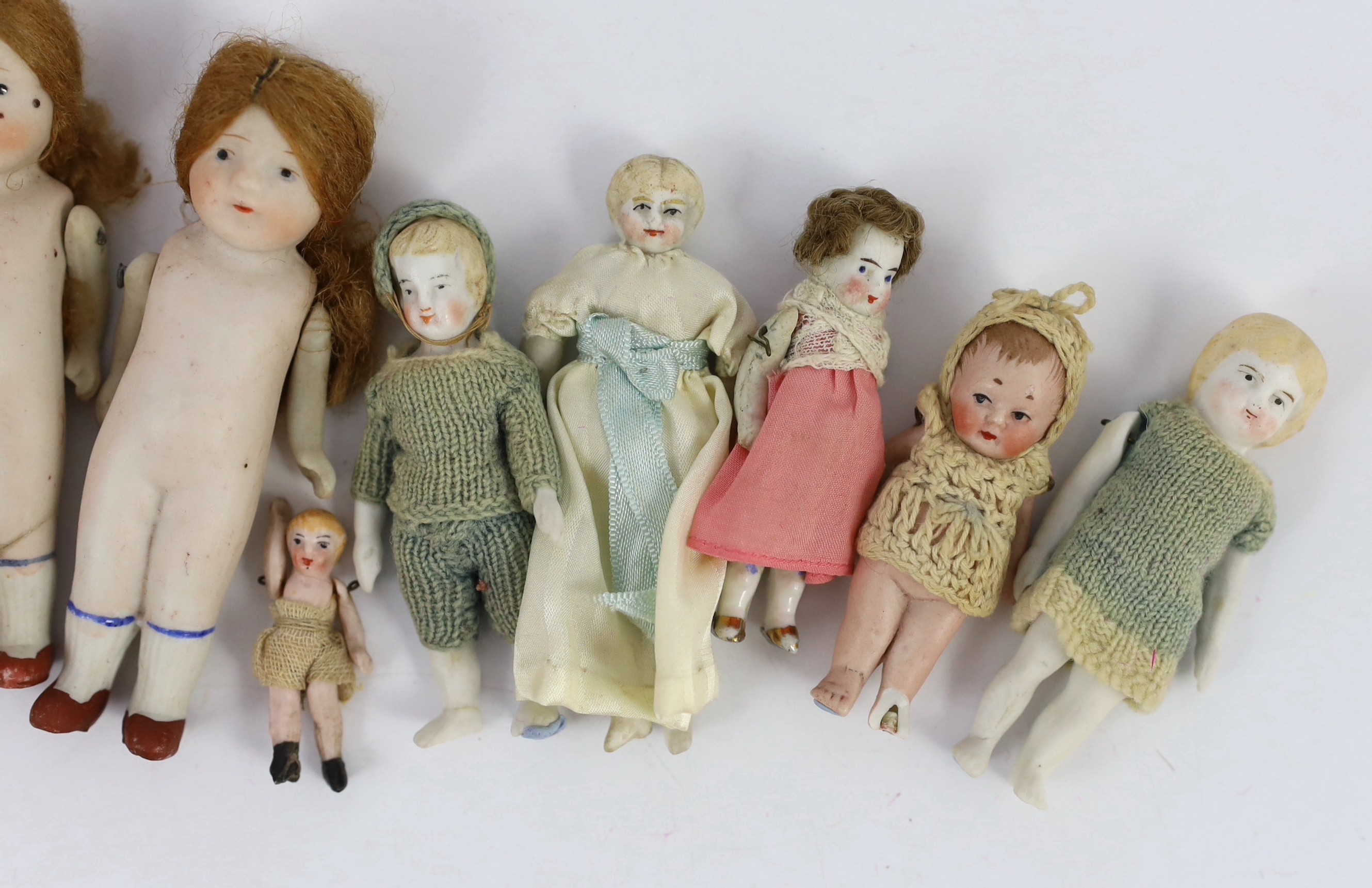 A group of thirteen all-bisque doll’s house dolls, German, early 20th century, tallest 5.5in.